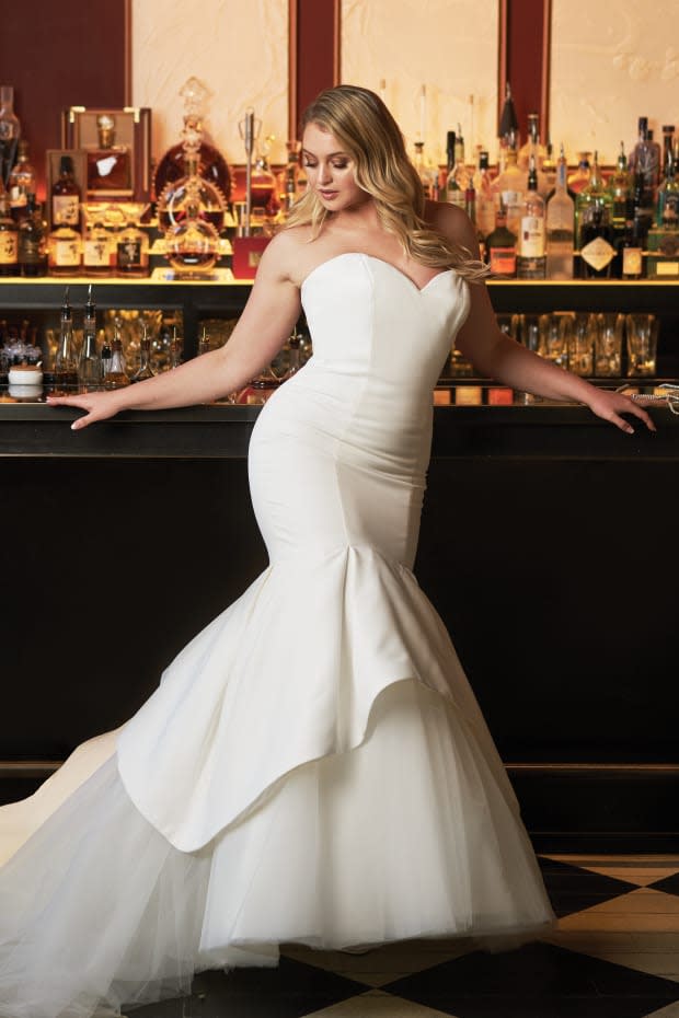 <p>Iskra Lawrence models a mermaid wedding dress (style no. 8933) from the Justin Alexander collection.</p>