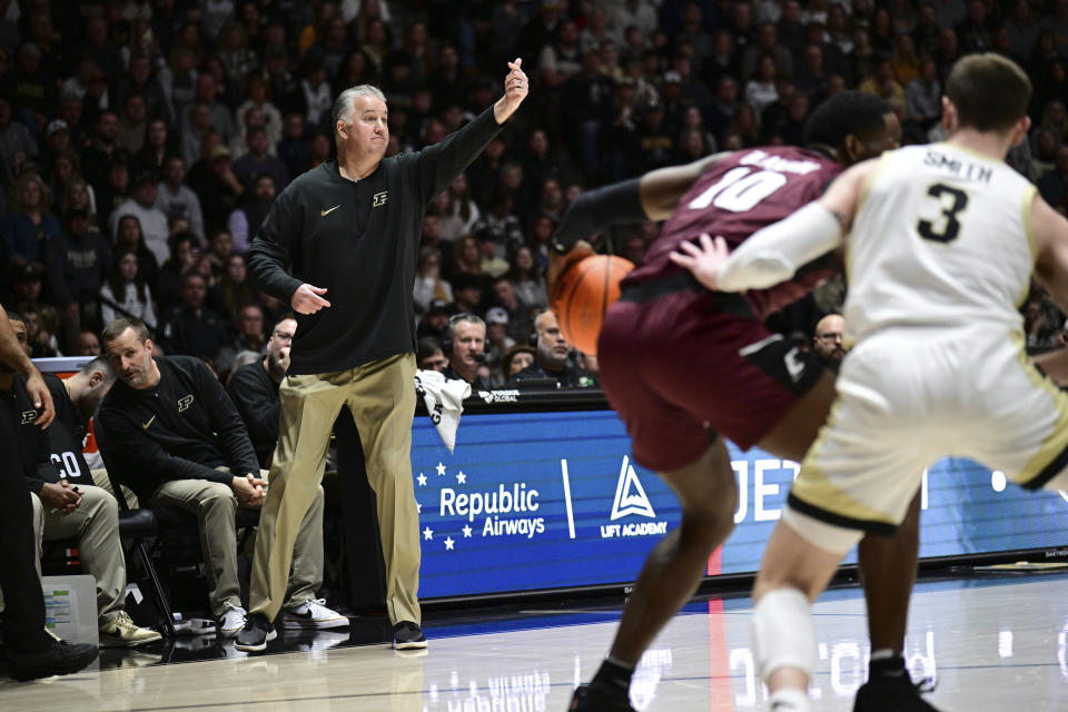 Purdue coach Matt Painter gestures to players during the first half of the team's NCAA basketball game against Eastern Kentucky, Friday, Dec. 29, 2023, in West Lafayette, Ind. (AP Photo/Marc Lebryk)