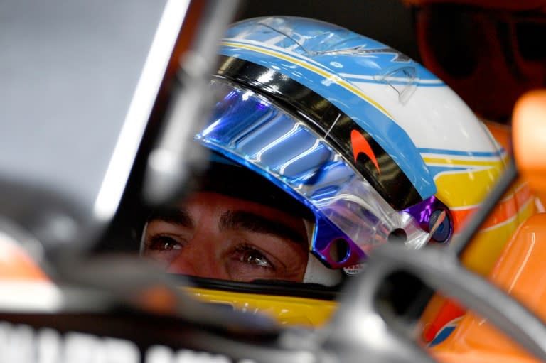 McLaren's Fernando Alonso sits in his car during the third practice session ahead of qualifying for the Bahrain Formula One Grand Prix at the Sakhir circuit in Manama on April 15, 2017