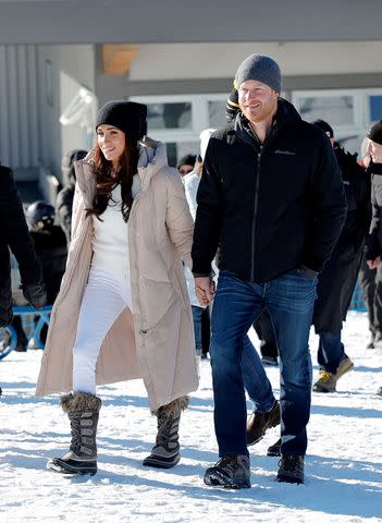 <p>Andrew Chin/Getty</p> Meghan Markle and Prince Harry at Invictus Games Winter Training Camp on Feb. 14, 2024