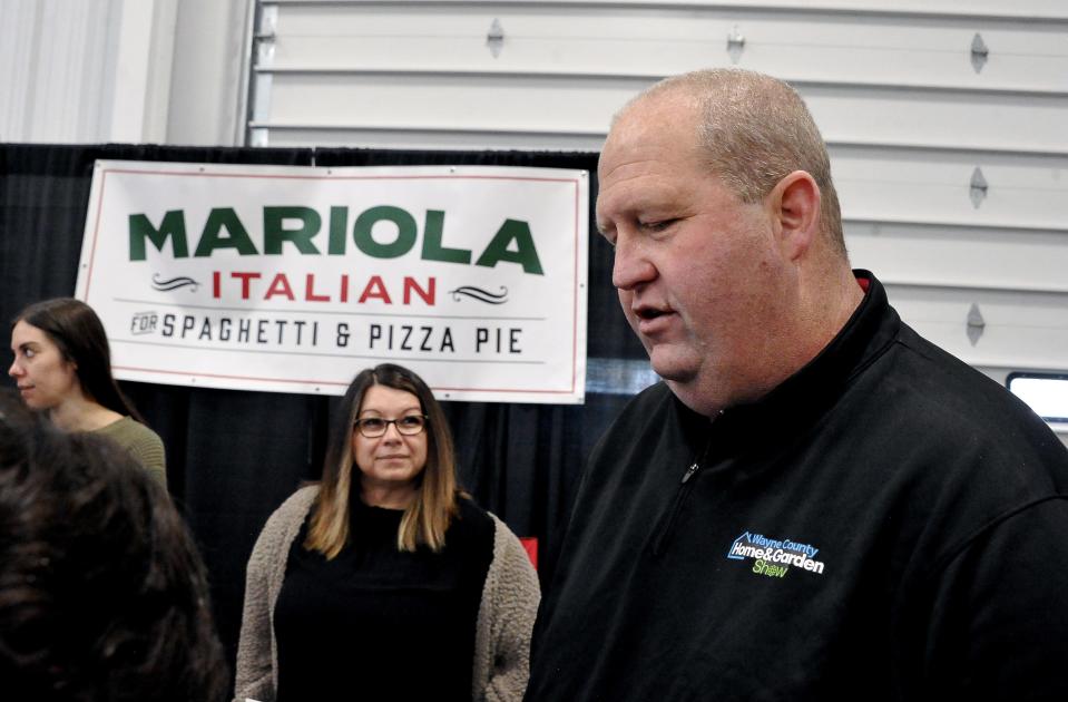 Mariola Italian Restaurant General Manager Mike Tepe answers questions and looks for employees at the Home and Garden Show. He also handed out a gift for kids in the scavenger hunt at the Home and Garden Show.