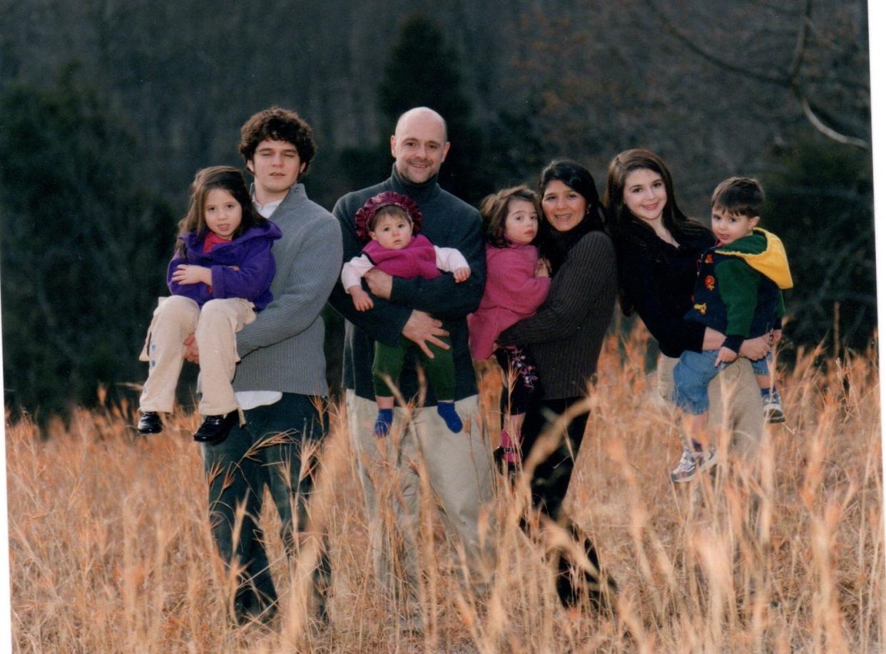 A Paige family photo from 2004. From left to right, Lilly, Jason, Carl, Grace, Nonni, Terri, Emily and Joseph. Terri is pregnant with Gus in this picture.