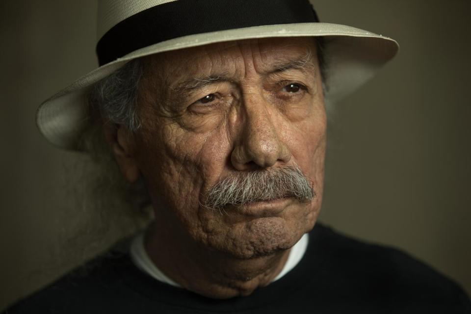 A man with weathered face wearing a hat