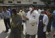 A team of experts from Indian health ministry visit an isolation ward for people who returned from China and under observation at the Government Fever Hospital in Hyderabad, India, Tuesday, Jan. 28, 2020. Countries with citizens in the central Chinese city that's the epicenter of a viral outbreak are planning evacuations as the number of illnesses grow and China takes drastic measures to try to stop the spread of the virus. (AP Photo/Mahesh Kumar A.)