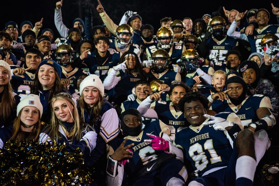 Newburgh celebrates their win during the NYSPHSAA Class AA semifinall football game in Middletown, NY on Saturday, November 26, 2022. Newburgh defeated Christian Brothers Academy. KELLY MARSH/FOR THE TIMES HERALD-RECORD