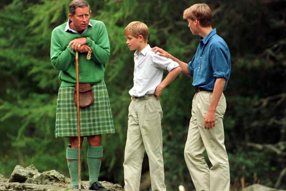 The Prince of wales with his sons Prince William (right) and Prince Harry above the Falls of Muick on the Balmoral estate, Scotland where they are taking a summer break (PA)