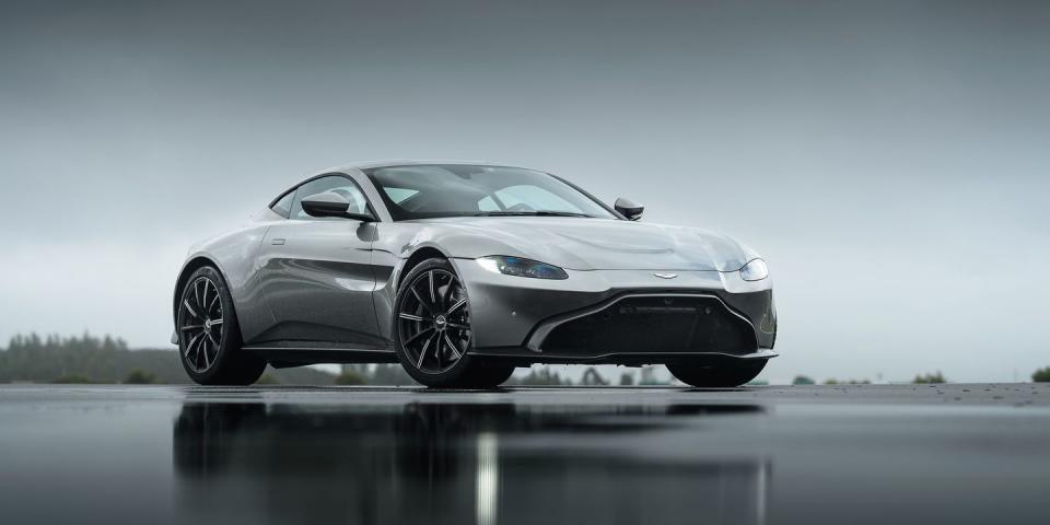 <p>With the clued-in suspension and excellent transmission, you can get comfy with the gas pedal. Lean on it firmly through curves, and you realize that the composure over bumps doesn’t come at the expense of body control. Like the DB11, the Vantage features two buttons on the top of its strangely square steering wheel’s spokes: left for damper modes, right for throttle, steering, and gearshift mapping. The Vantage skips the DB11’s GT damper setting, which feels too soft for any remotely energetic driving, and goes straight for Sport, then Sport Plus, and Track.</p><p>There’s a smidge of body roll but no understeer, so you can push harder on the gas and feel the rear tires load up as the corner opens. The tail will go wide, but only with a decisive nod from the driver. Given the go-ahead and with the stability system disengaged, it arcs neatly around, the electronically controlled limited-slip differential-fitted here for the first time-making it easy to moderate just how much of your view forward you want to take in through the door window, rather than the windshield.</p><p><em>Continue reading our about our drive of the all new Vantage <a href="https://www.roadandtrack.com/new-cars/first-drives/a19723672/2019-aston-martin-vantage-first-drive/" rel="nofollow noopener" target="_blank" data-ylk="slk:here;elm:context_link;itc:0;sec:content-canvas" class="link ">here</a>. </em></p>