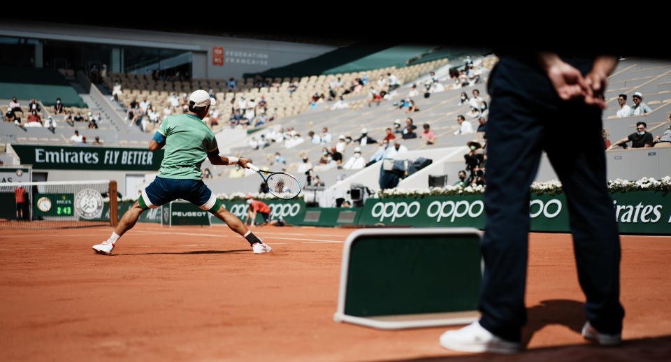 Japan's Kei Nishikori plays a return to Russia's Karen Khachanov during their second round match on day four of the French Open tennis tournament at Roland Garros in Paris, France, Wednesday, June 2, 2021. (AP Photo/Thibault Camus)