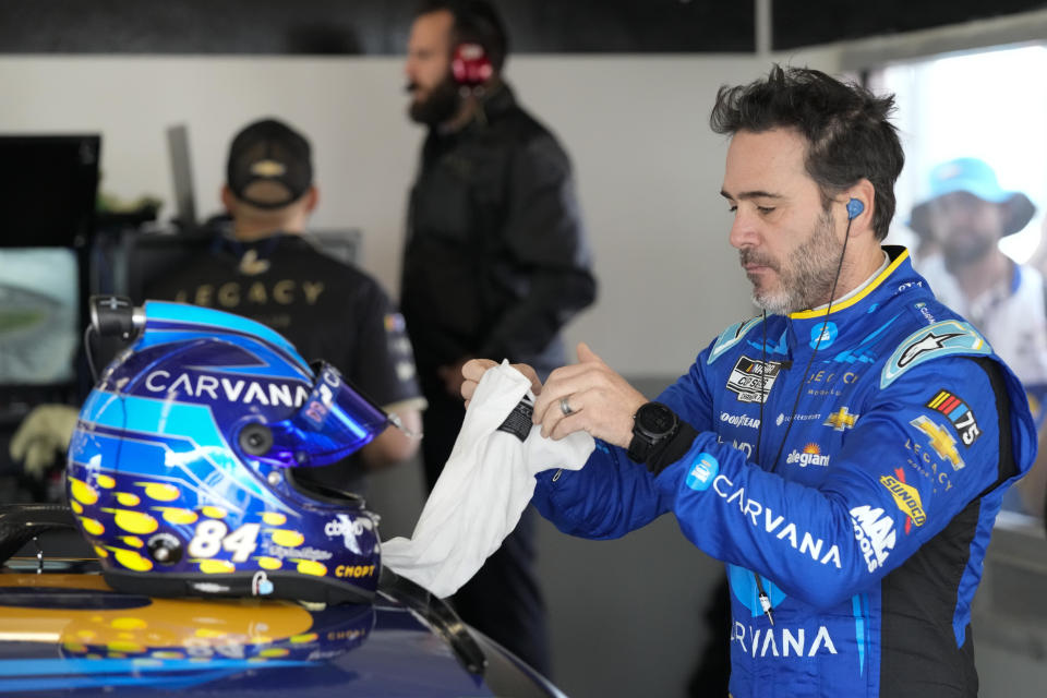 Jimmie Johnson prepares himself before the start of a practice session for the NASCAR Daytona 500 auto race at Daytona International Speedway, Saturday, Feb. 18, 2023, in Daytona Beach, Fla. (AP Photo/John Raoux)