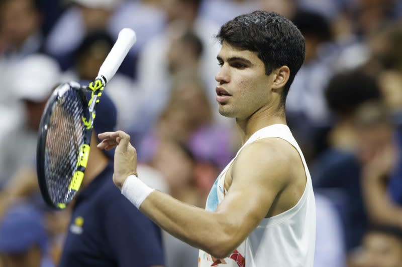 Carlos Alcaraz of Spain flips his racket while Dominik Koepfer of Germany receives treatment in their first-round match at the 2023 U.S. Open on Tuesday at the USTA Billie Jean King National Tennis Center in Flushing, N.Y. Photo by John Angelillo/UPI