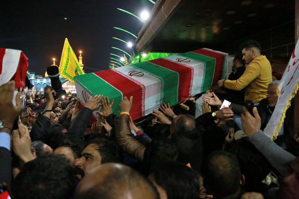 Mourners carry the coffin of Iran's top general Qassem Soleimani during his funeral in Karbala, Iraq, Saturday, Jan. 4, 2020. Iran has vowed "harsh retaliation" for the U.S. airstrike near Baghdad's airport that killed Tehran's top general and the architect of its interventions across the Middle East, as tensions soared in the wake of the targeted killing. (AP Photo/Khalid Mohammed)