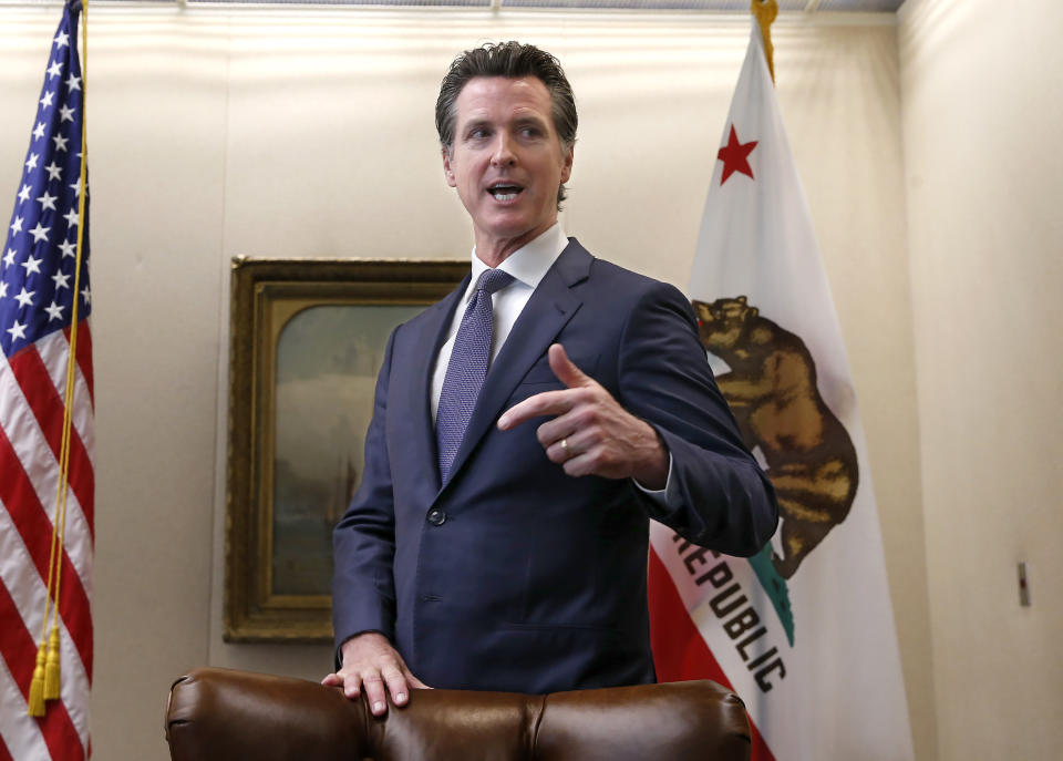 Gov. Gavin Newsom discusses his decision to fire state Oil and Gas Supervisor Ken Harris while talking with reporter's at his office in Sacramento, Calif., Friday, July 12, 2019. Newsom said he fired Harris, Thursday, July 11, 2019, because he did not "exercise consistency" with the governor's opposition to hydraulic fracturing.(AP Photo/Rich Pedroncelli)