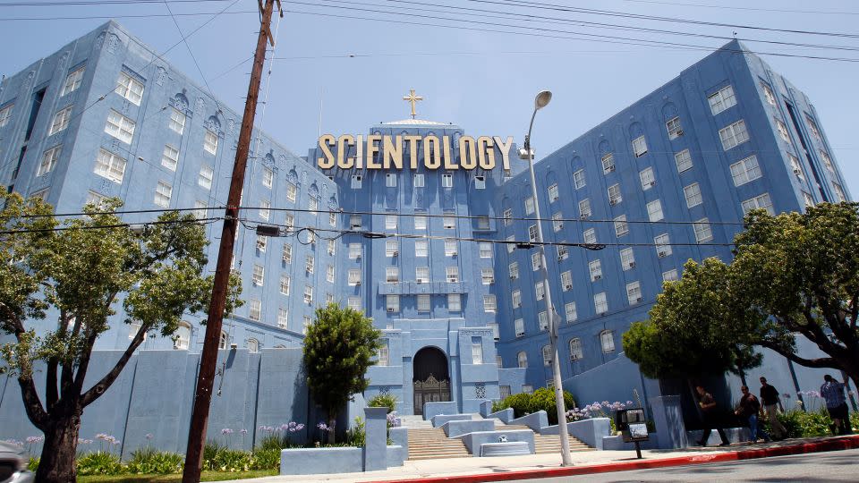 People walk past the Church of Scientology in Los Angeles in 2012. - Mario Anzuoni/Reuters/FILE