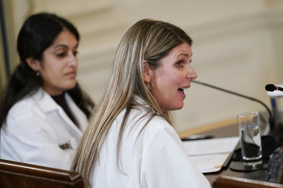 Dr. Kristin Lyerly, right, speaks during a meeting of the reproductive rights task force at the White House in 2022.  (Susan Walsh / AP file)