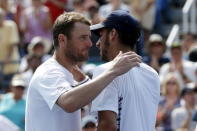 Mardy Fish of the U.S. (L) embraces Feliciano Lopez of Spain at the net after Lopez won their five set match at the U.S. Open Championships tennis tournament in New York, September 2, 2015. The match was the last of Fish's professional career. REUTERS/Mike Segar