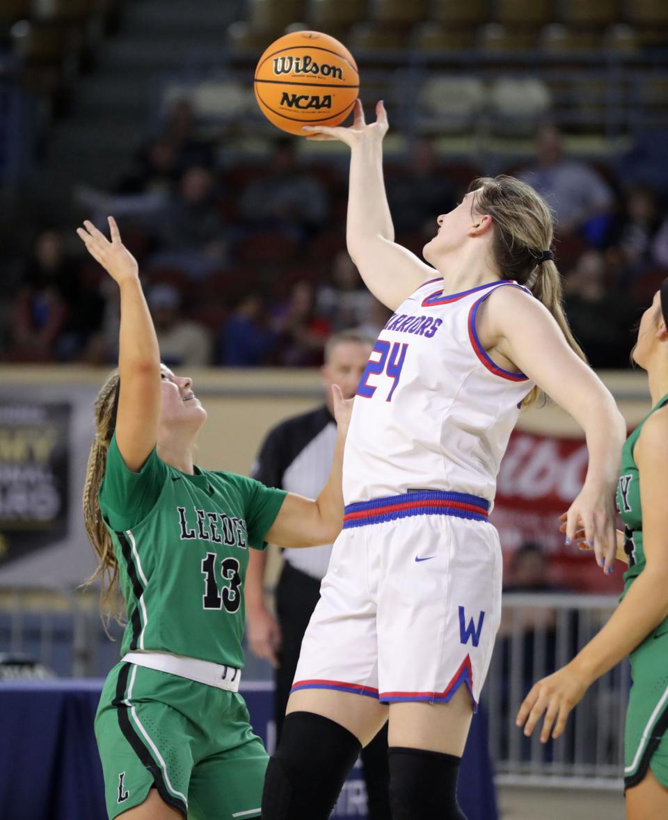 Hammon's Henley West, right, reaches for the ball over Leedey's Daycee Danielson during a Class B girls state basketball tournament quarterfinal game at State Fair Arena in Oklahoma City, Thursday, March 2, 2023. 