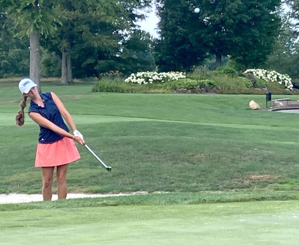 Anna Swan chips out of a sand bunker and onto the green of Lake View Country Club's first hole during her final vs. sister Lydia Swan in Sunday's Erie District Women's Golf Association Match Play Tournament. Anna Swan lost the hole, but won the match 3 and 2.