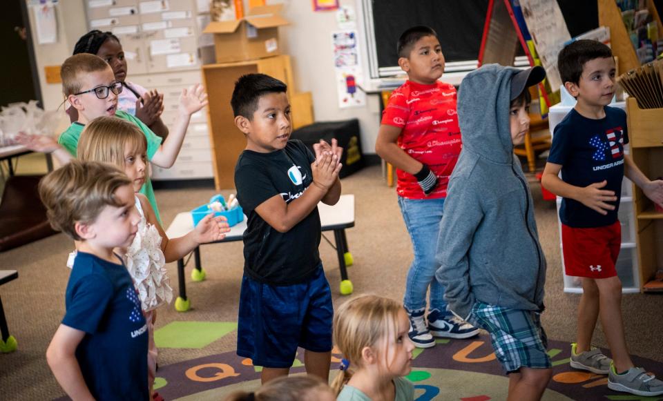 Anthony Borjas-Garcia claps along with a song as he participates in a body movement exercise during Monroe County Community School Corporation's Jump Start program at Summit Elementary School on Friday, July 21, 2023.