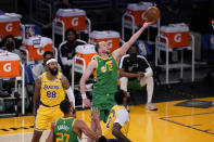 Utah Jazz guard Joe Ingles (2) scores past Los Angeles Lakers forward Markieff Morris (88) during the second half of an NBA basketball game Monday, April 19, 2021, in Los Angeles. (AP Photo/Marcio Jose Sanchez)