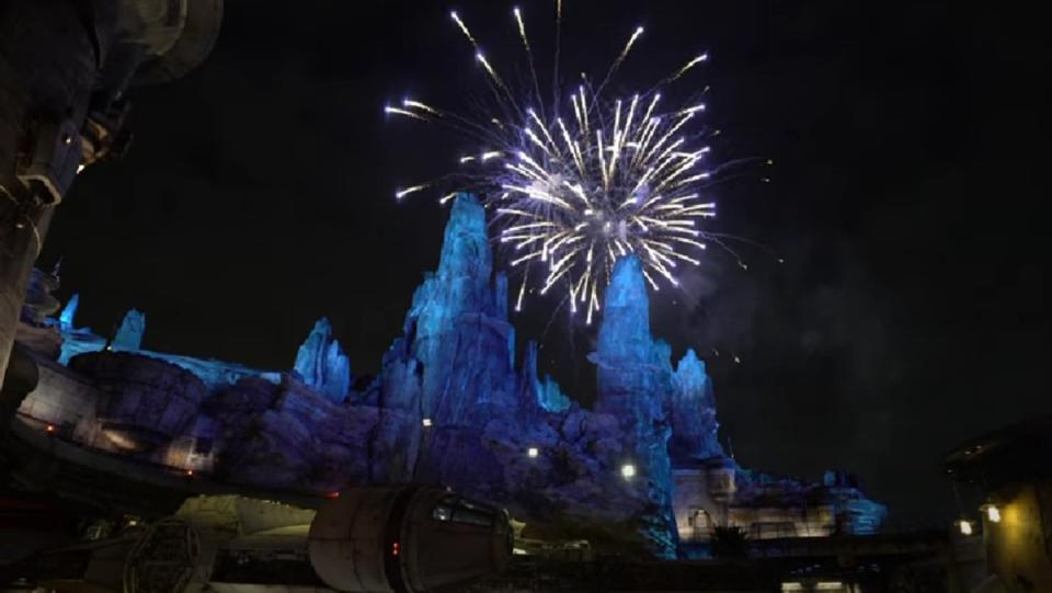 Fireworks explode over Star Wars: Galaxy's Edge at the Disneyland Resort.