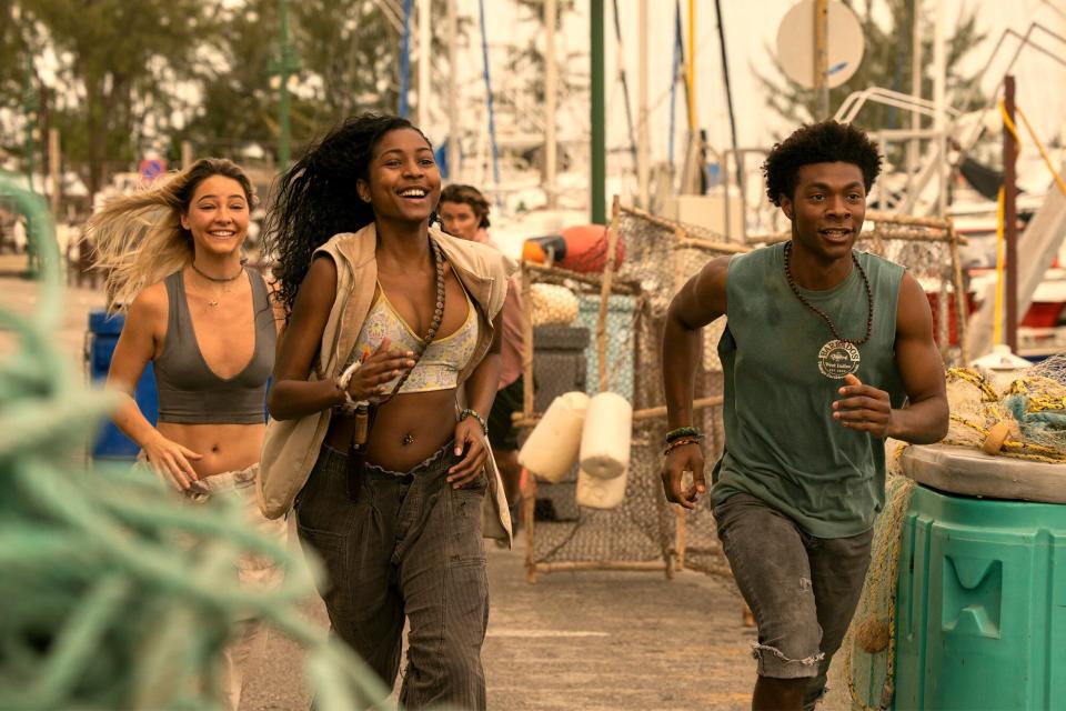 Outer Banks. (L to R) Madelyn Cline as Sarah Cameron, Carlacia Grant as Cleo, Jonathan Daviss as Pope in episode 302 of Outer Banks. Cr. Jackson Lee Davis/Netflix © 2023