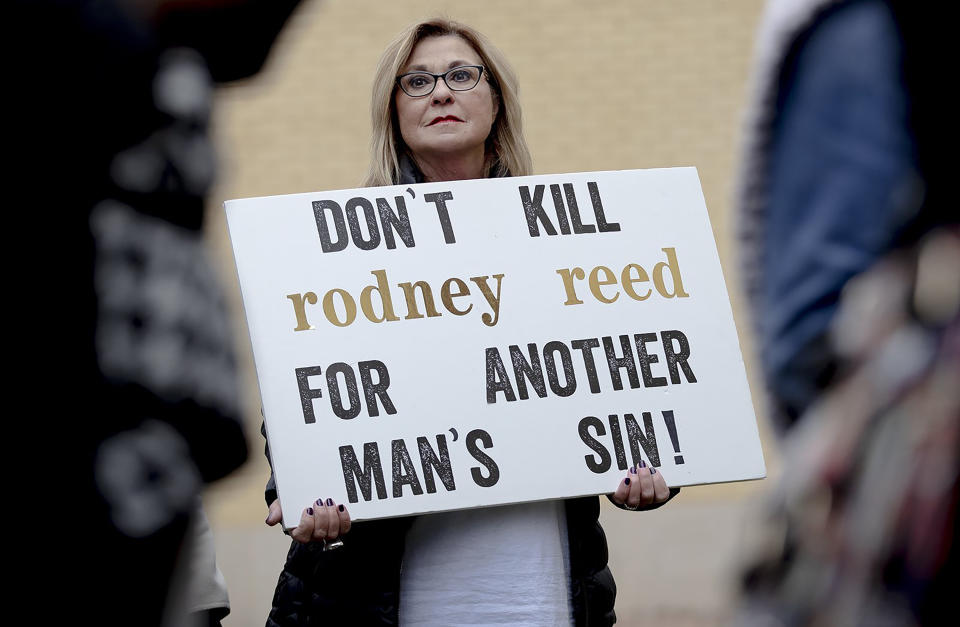 A woman holds a sign during a protest against the execution of Rodney Reed on Wednesday, Nov. 13, 2019, in Bastrop, Texas. Protesters rallied in support of Rodney Reed’s campaign to stop his scheduled Nov. 20 execution for the 1996 killing of a 19-year-old Stacy Stites. New evidence in the case has led a growing number of Texas legislators, religious leaders and celebrities to press Gov. Greg Abbott to intervene. (Nick Wagner/Austin American-Statesman via AP)