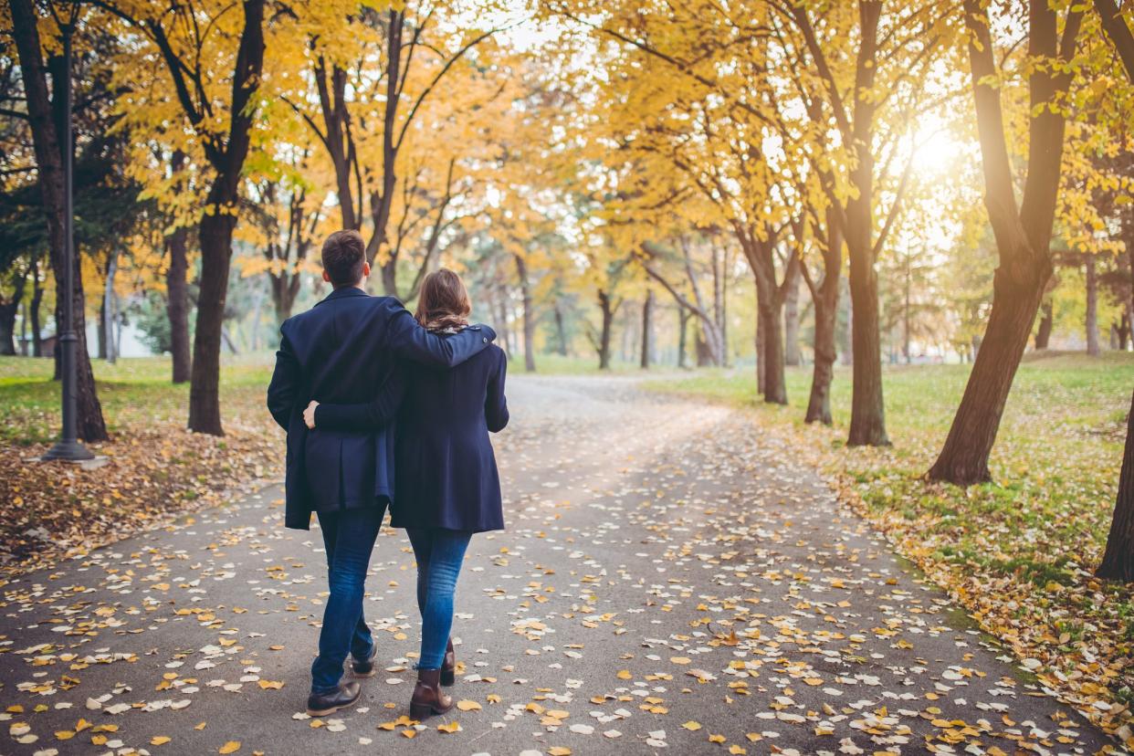 Young cute Caucasian couple in a public park.