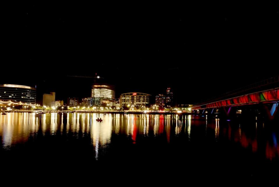 Boaters navigate Tempe Town Lake in Tempe, Ariz. Growth in the greater Phoenix area is fast outpacing the supply of water.