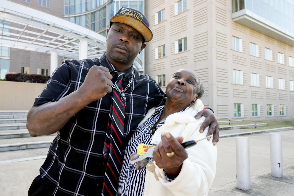 Eddie Terrell Parker and his aunt Linda Rawls express their joy at the 40-year prison sentence given to former Rankin County sheriff's deputy Christian Dedmon by a federal judge, Wednesday, March 20, 2024, in Jackson, Miss. Dedmon was sentenced for his part in the racist torture of Parker and Michael Corey Jenkins by a group of white officers who called themselves the “Goon Squad.” (AP Photo/Rogelio V. Solis)