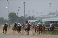 May 5, 2018; Louisville, KY, USA; Mike Smith aboard Justify (7) and the rest of the field at the start during the 144th running of the Kentucky Derby at Churchill Downs. Mandatory Credit: Jerry Lai-USA TODAY Sports