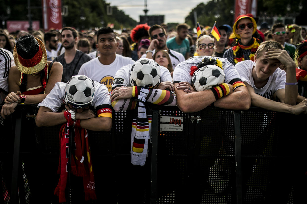 BERLIN, GERMANY - JUNE 27: Fans react during the public viewing in front of the Brandenburg Gate of the game Germany versus South Korea at the FIFA Soccer World Championship on June 27, 2018 in Berlin, Germany. (Photo by Florian Gaertner/Photothek via Getty Images)