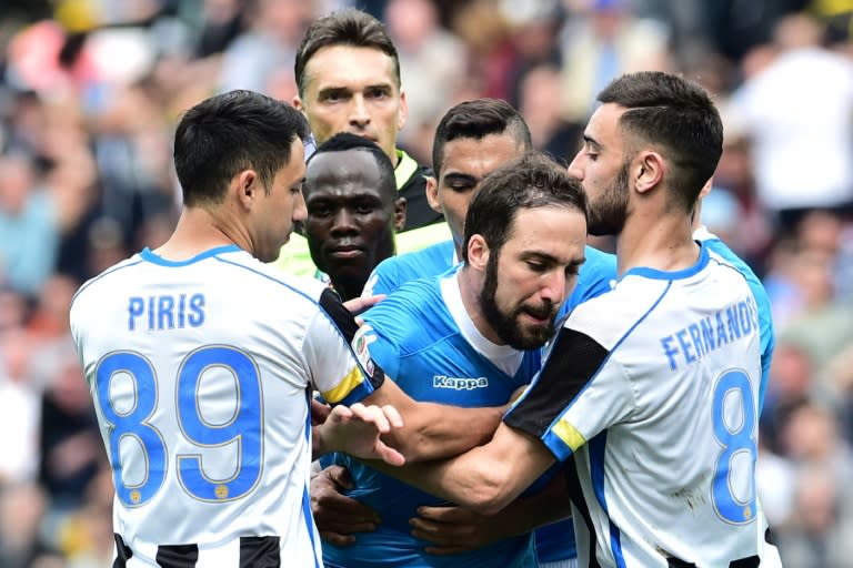 Napoli forward Gonzalo Higuain (C) reacts after he received a red card against Udinese on April 3, 2016