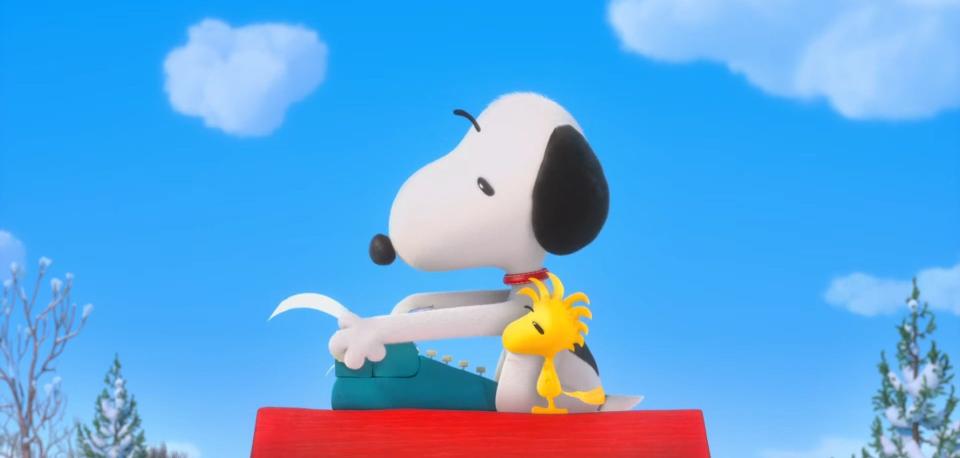 Snoopy and Woodstock looking at a typewriter in "The Peanuts Movie"