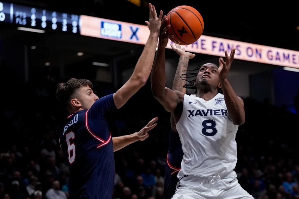Xavier Musketeers guard Quincy Olivari (8) floats to the basket in the first half of the NCAA Men’s basketball game between the Xavier Musketeers and the Robert Morris Colonials at the Cintas Center in Cincinnati on Monday, Nov. 6, 2023.