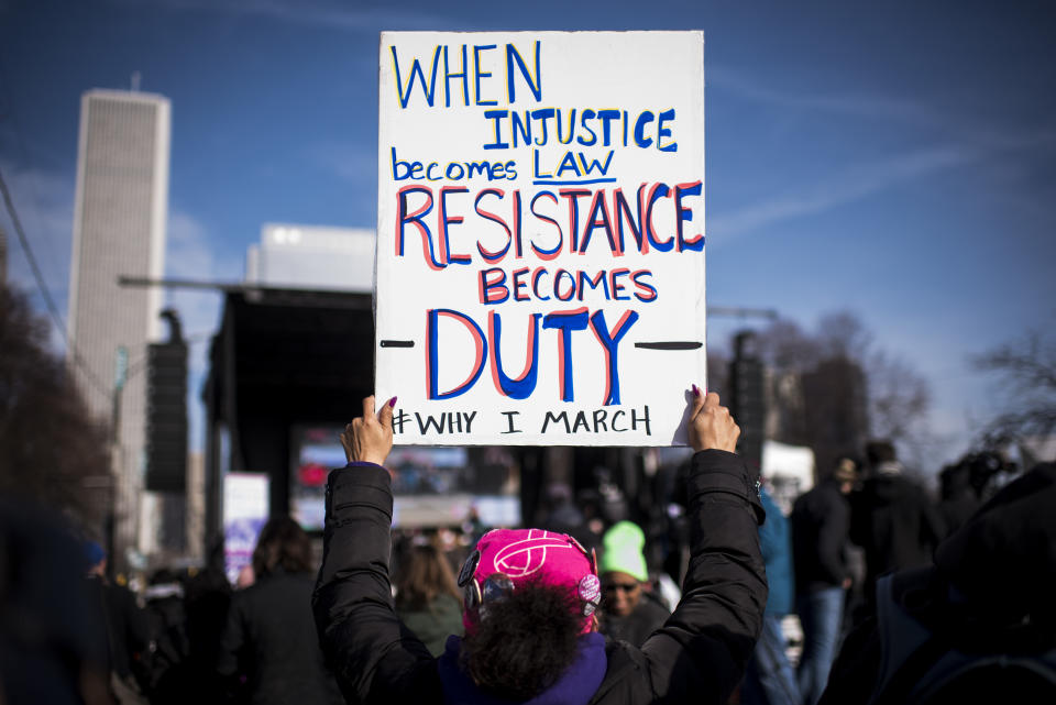 <p>A demonstrator holds a sign that reads “When Injustice Becomes Law, Resistance Becomes Duty” during the second annual Women’s March in Chicago, Ill., on Saturday, Jan. 20, 2018. (Photo: Christopher Dilts/Bloomberg via Getty Images) </p>