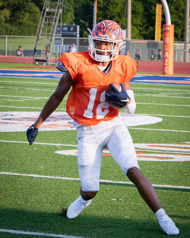 Blackman's Justin Brown looks upfield after making a reception during Tuesday's scrimmage vs. Lebanon.