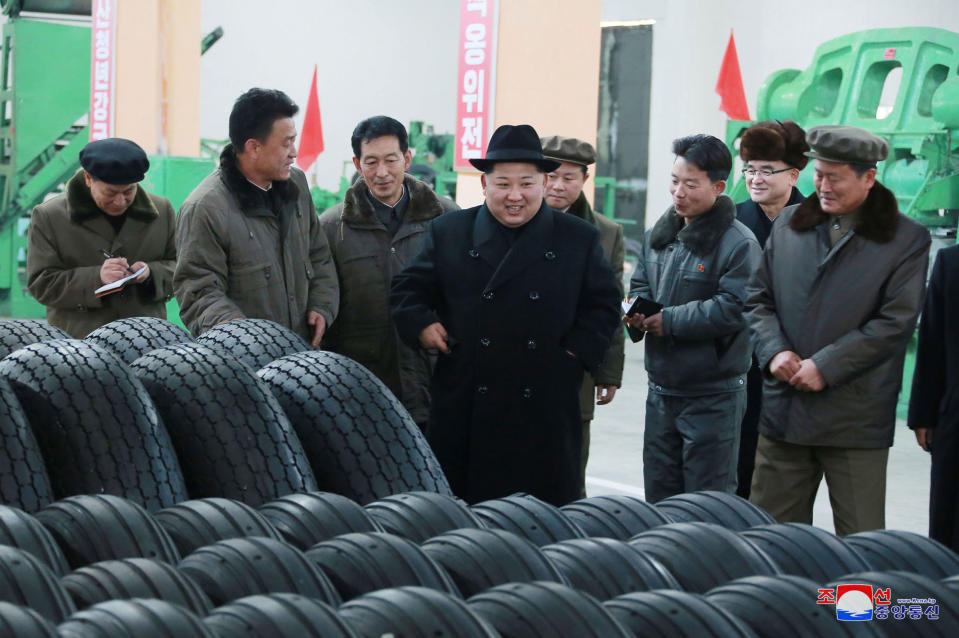 <em>Thanks – Kim Jong-un reportedly thanked workers who built the tyres for the vehicle to transport the regime’s ballistic missile (Pictures: AP)</em>