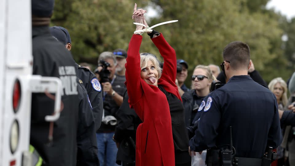 Fonda is taken away in ziptie handcuffs as she is arrested during a climate crisis protest at the US Capitol in October 2019. - John Lamparski/Getty Images