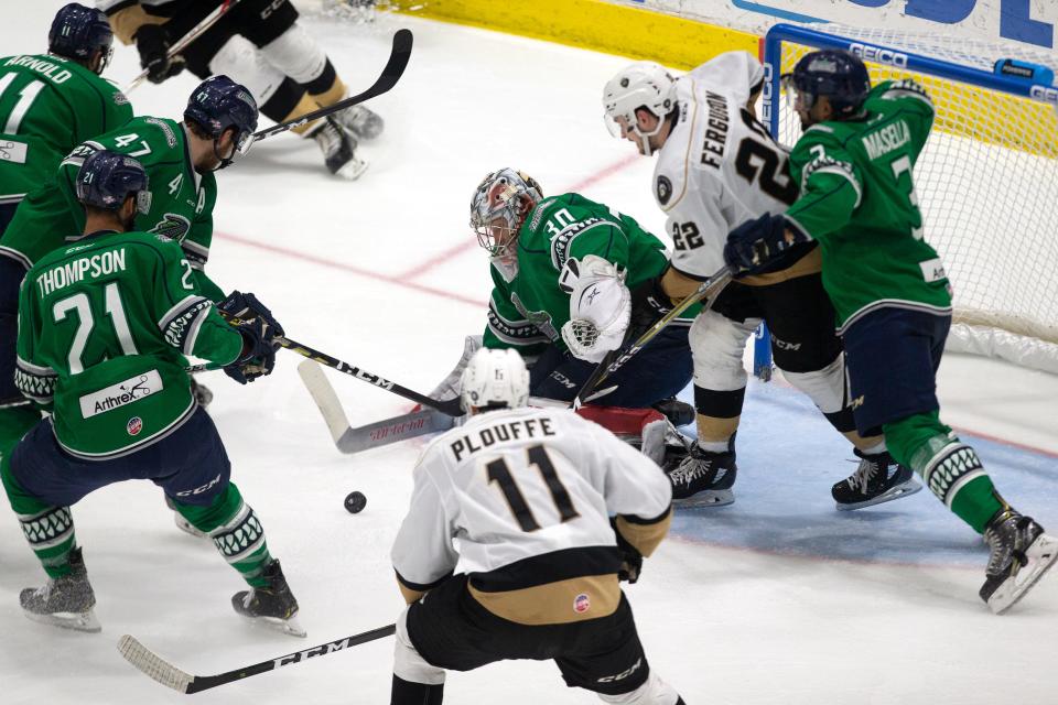 Florida Everblades help their goalie Callum Booth defend the net against an attack by the Newfoundland Growlers during Game 1 of the ECHL Eastern Conference Finals, Friday, May 10, 2019, at Hertz Arena in Estero.