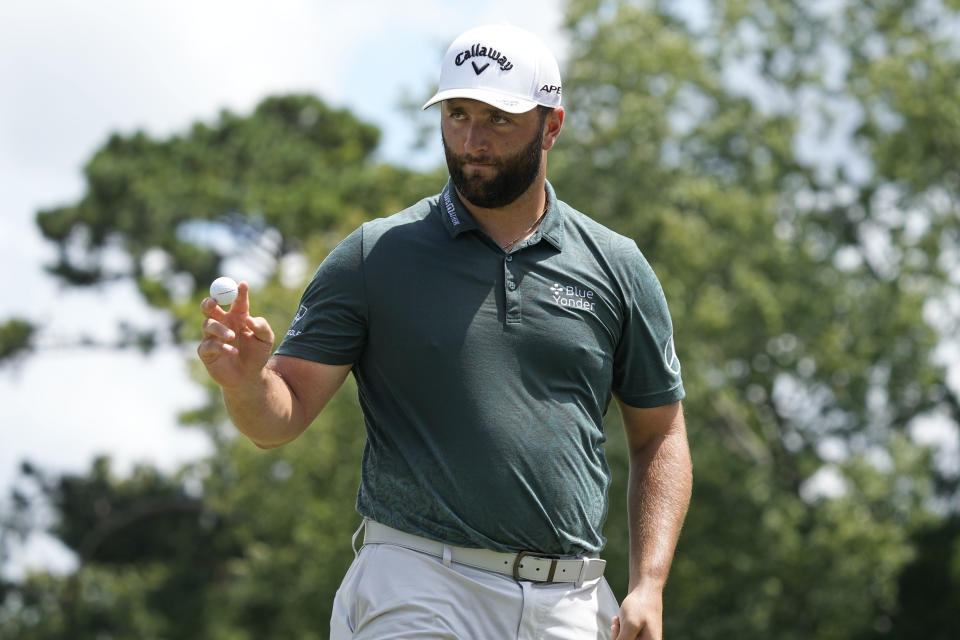 Jon Rahm, of Spain, waves after his birdie putt on the third green during the second round of the Tour Championship golf tournament at East Lake Golf Club, Friday, Aug. 26, 2022, in Atlanta. (AP Photo/Steve Helber)