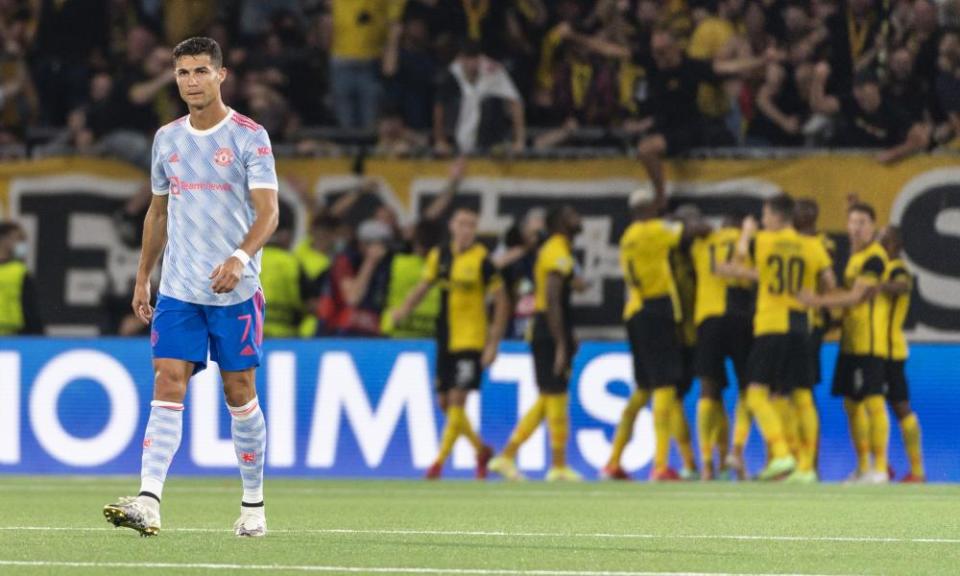 Cristiano Ronaldo looks dejected as Young Boys celebrate scoring against Manchester United