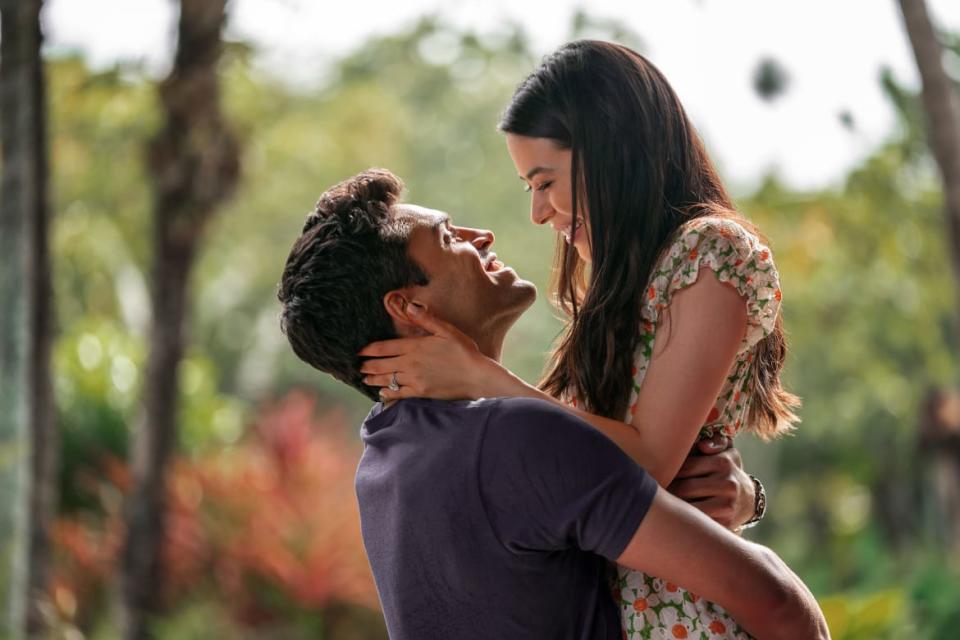 Sean Teale and Miranda Cosgrove hug in a still from ‘Mother of the Bride’