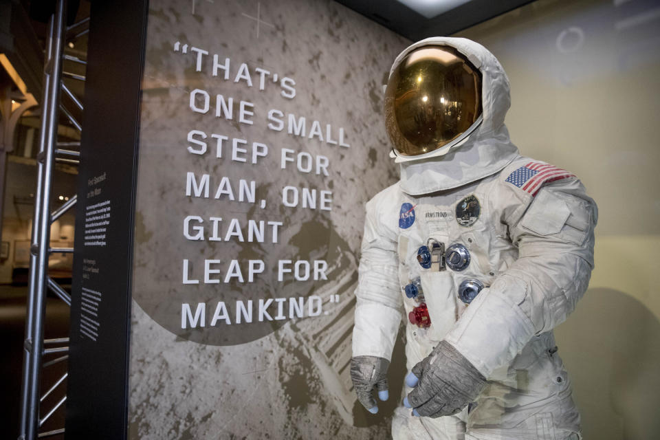 Neil Armstrong's Apollo 11 spacesuit is unveiled at the Smithsonian's National Air and Space Museum on the National Mall in Washington, Tuesday, July 16, 2019. (AP Photo/Andrew Harnik)