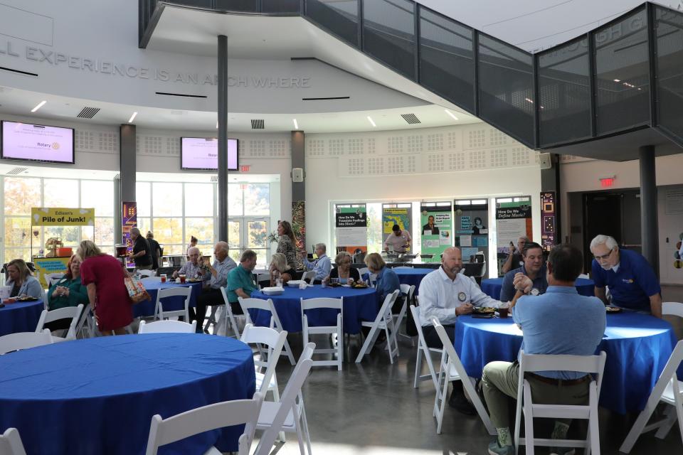 Rotary Club members socialize and eat lunch during a Rotary Club of Gainesville meeting in the Cade Museum for Creativity and Invention in Gainesville, FL on Tuesday, Sept. 26, 2023.