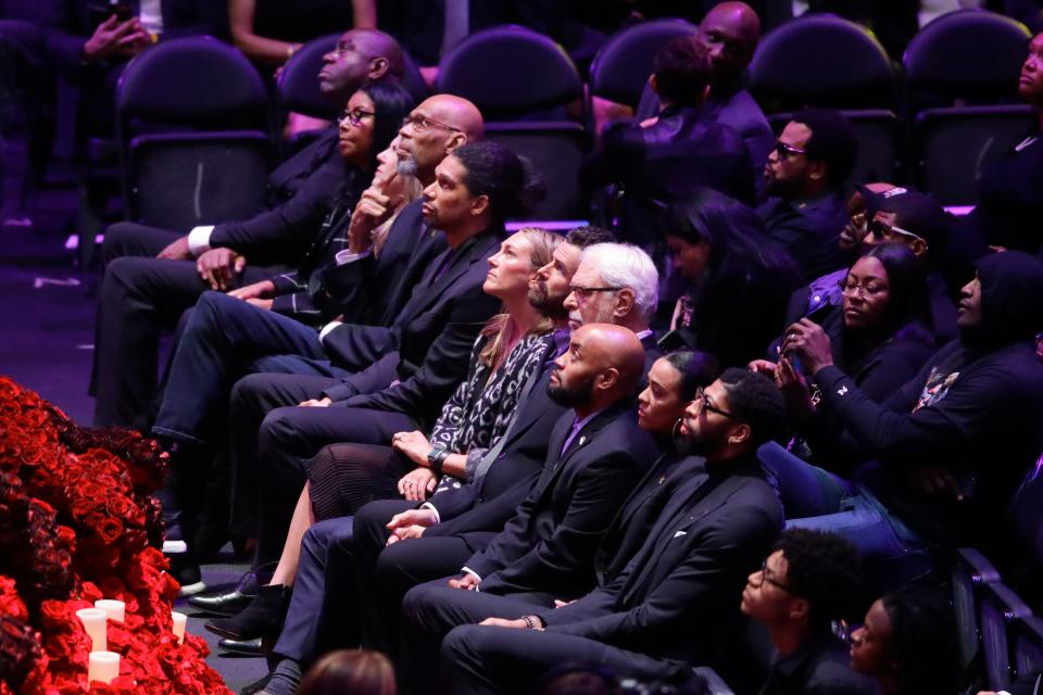 Former Lakers superstars Magic Johnson, top left, and Kareem Abdul-Jabbar, third one down from Johnson, and ex-coach Phil Jackson (gray hair) are among the basketball luminaries at the memorial for Kobe Bryant and his daughter Gianna.