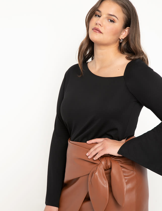 Asymmetric Neckline Top with Sleeve Slits. Image via Eloquii.