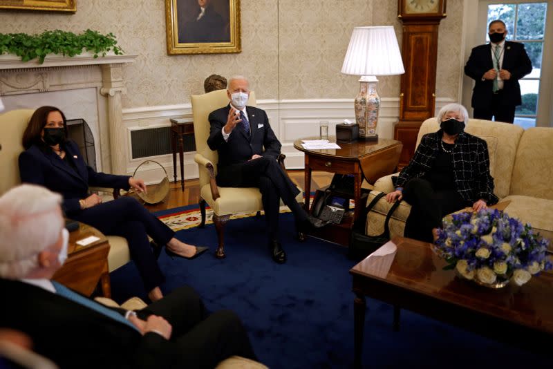 FILE PHOTO: U.S. President Joe Biden and U.S. Vice President Kamala Harris, accompanied by U.S. Treasury Secretary Janet Yellen attend a meeting business leaders at the Oval Office of the White House in Washington, U.S.