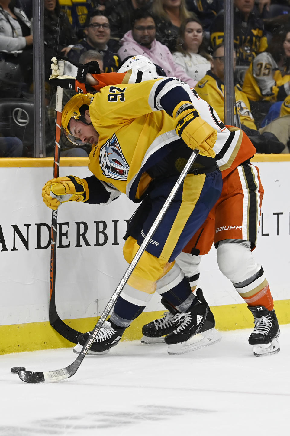 Nashville Predators center Ryan Johansen (92) works agianst Anaheim Ducks defenseman Kevin Shattenkirk, right, for the puck during the second period of an NHL hockey game Tuesday, Nov. 29, 2022, in Nashville, Tenn. (AP Photo/Mark Zaleski)