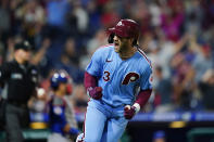 Philadelphia Phillies' Bryce Harper reacts after hitting a three-run home run against Chicago Cubs pitcher Rex Brothers during the seventh inning of a baseball game, Thursday, Sept. 16, 2021, in Philadelphia. (AP Photo/Matt Slocum)