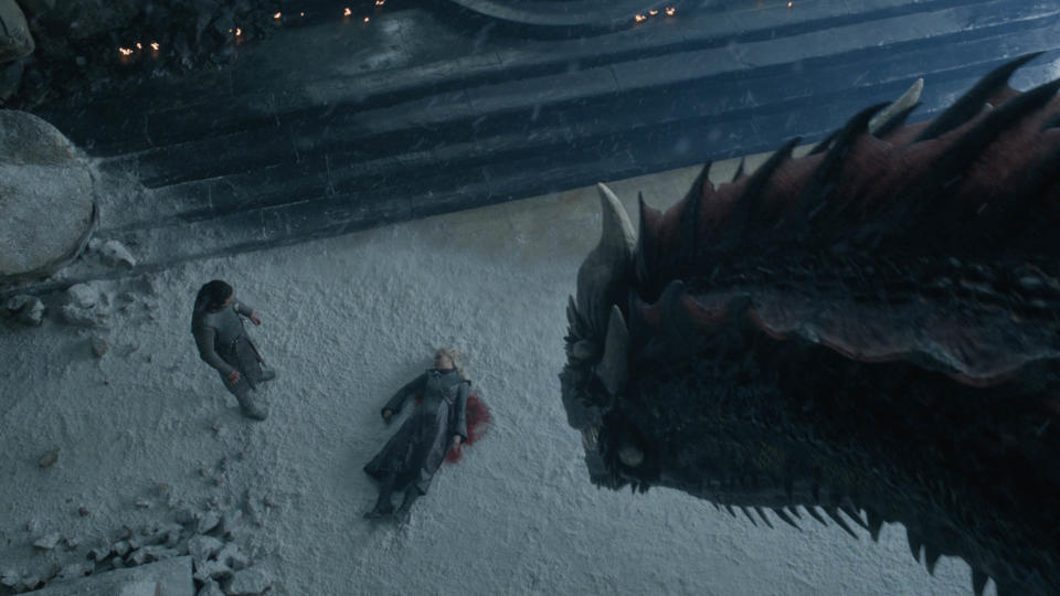 Aerial shot of Dragon looking at Jon Snow over Daenerys' dead body on Game of Thrones' series finale | Helen Sloan—HBO